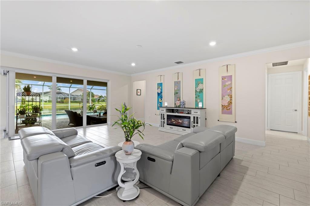 10530 Jackson Square Drive Estero, FL 33928 - Photo 20 of 48 a living room with furniture and a large window
