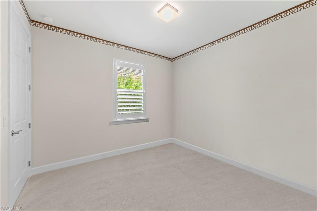 10530 Jackson Square Drive Estero, FL 33928 - Photo 28 of 48 a view of an empty room with a window