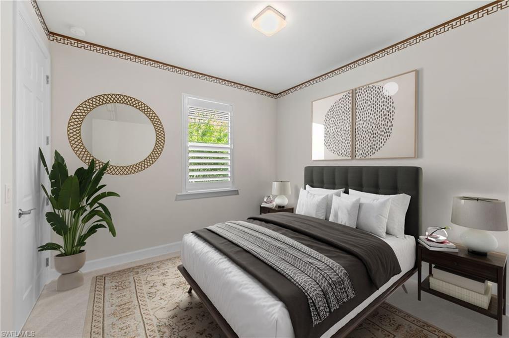 10530 Jackson Square Drive Estero, FL 33928 - Photo 29 of 48 a bedroom with a bed and a potted plant
