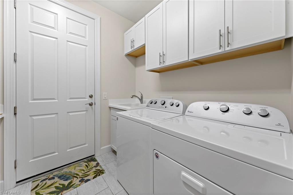 10530 Jackson Square Drive Estero, FL 33928 - Photo 31 of 48 a utility room with dryer and washer