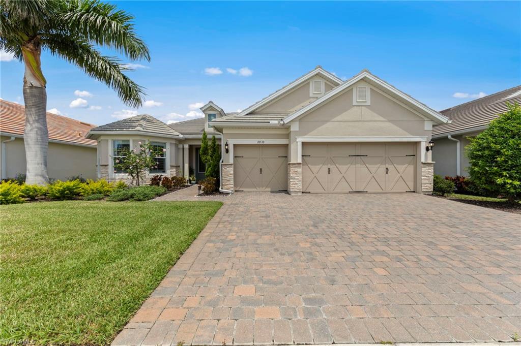10530 Jackson Square Drive Estero, FL 33928 - Photo 42 of 48 a front view of a house with garden