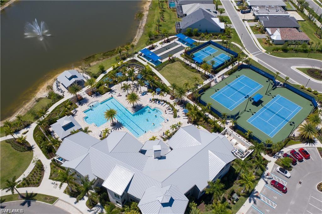 10530 Jackson Square Drive Estero, FL 33928 - Photo 44 of 48 an aerial view of a residential apartment building with a yard