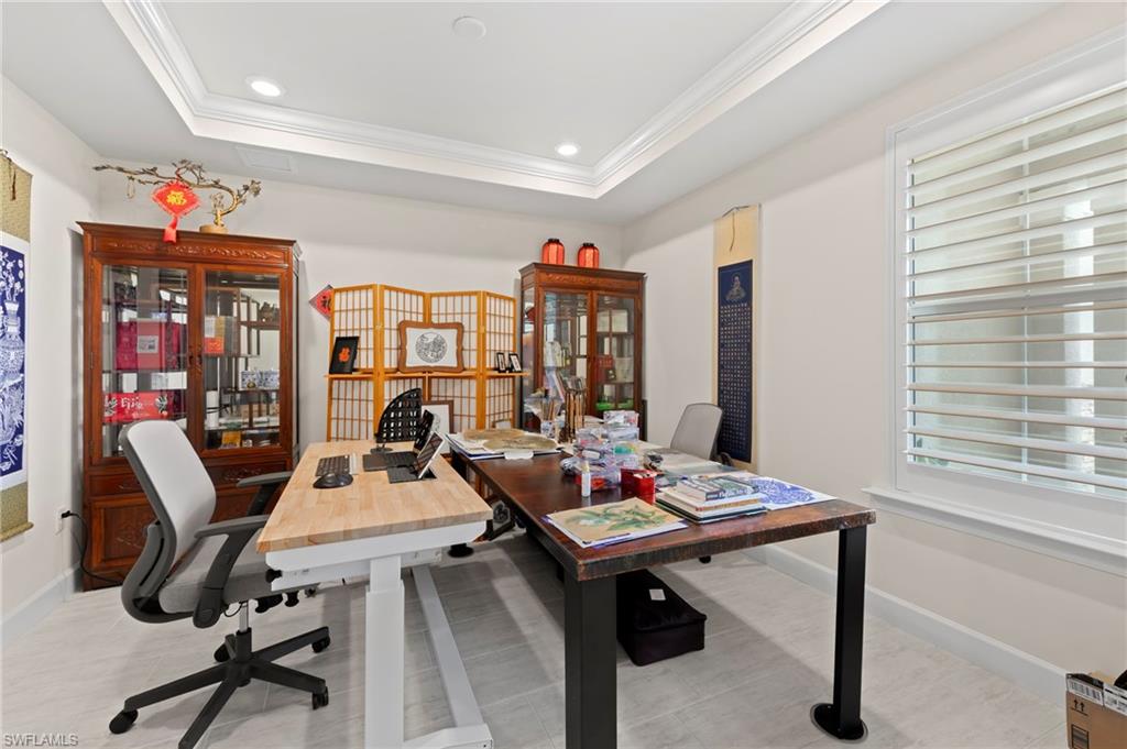 10530 Jackson Square Drive Estero, FL 33928 - Photo 6 of 48 a view of a workspace with furniture and a potted plant