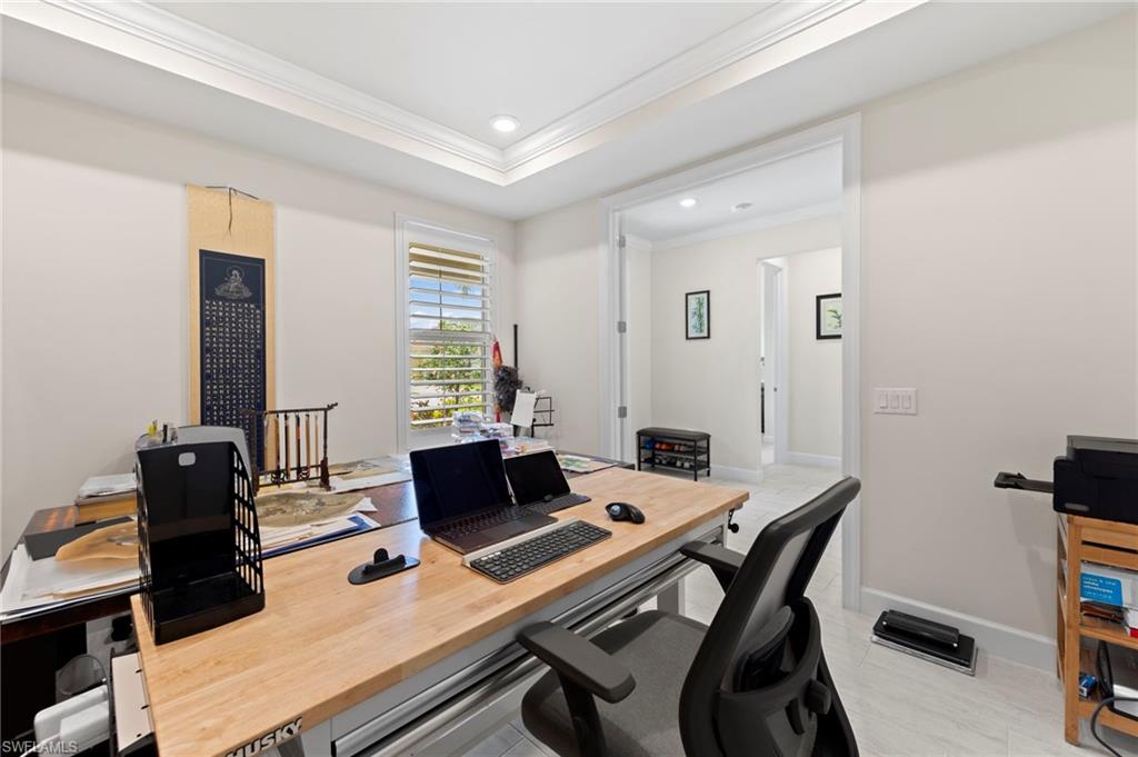 10530 Jackson Square Drive Estero, FL 33928 - Photo 9 of 48 a view of a workspace with furniture and a window