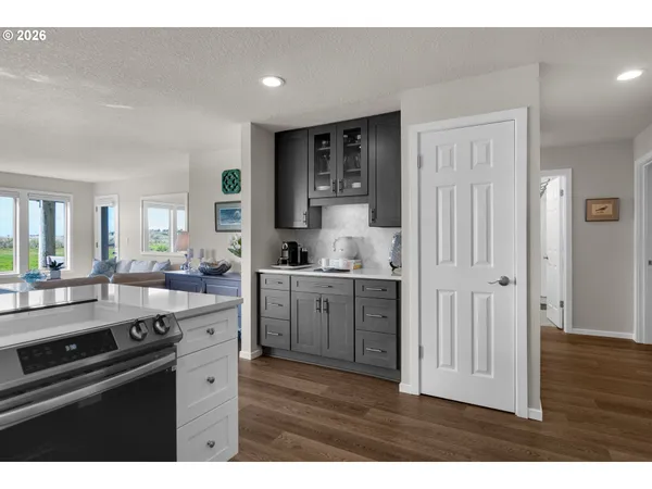 a kitchen with refrigerator and cabinets