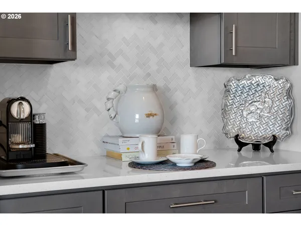 a kitchen with kitchen island a sink stainless steel appliances and cabinets