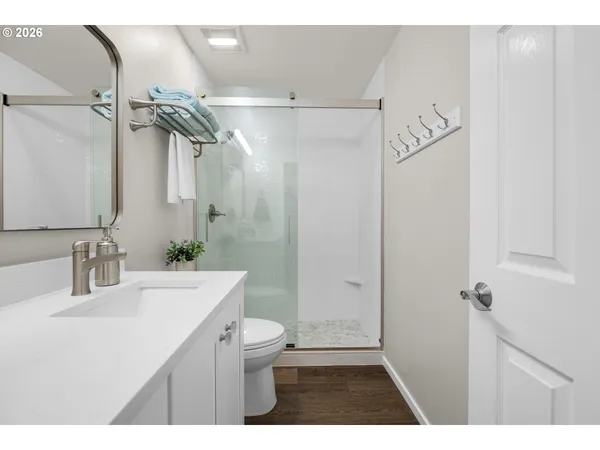 a room with lots of white furniture and gym equipment
