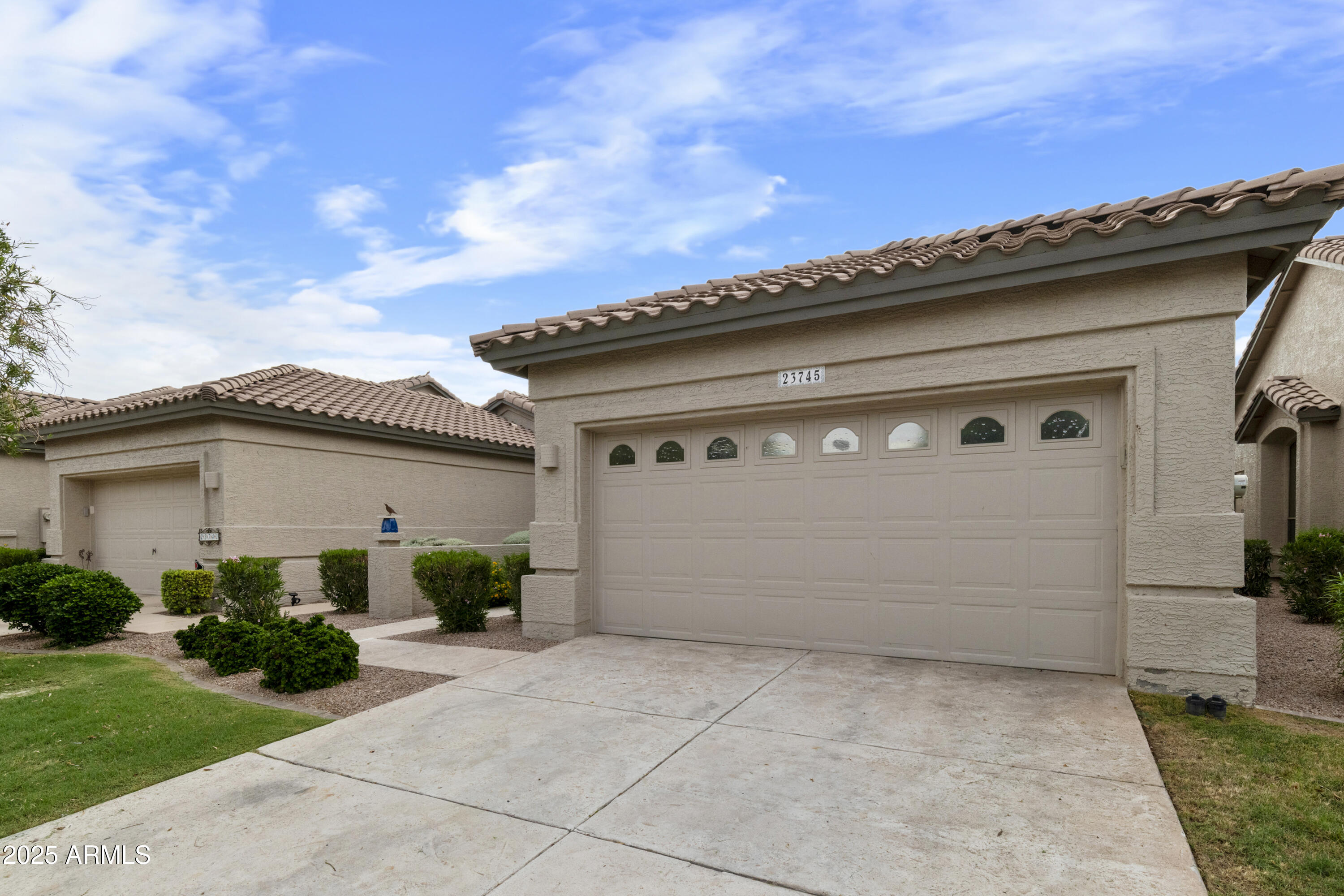 23745 South Vacation Way Sun Lakes, AZ 85248 - Photo 3 of 52 a view of white house with a outdoor space