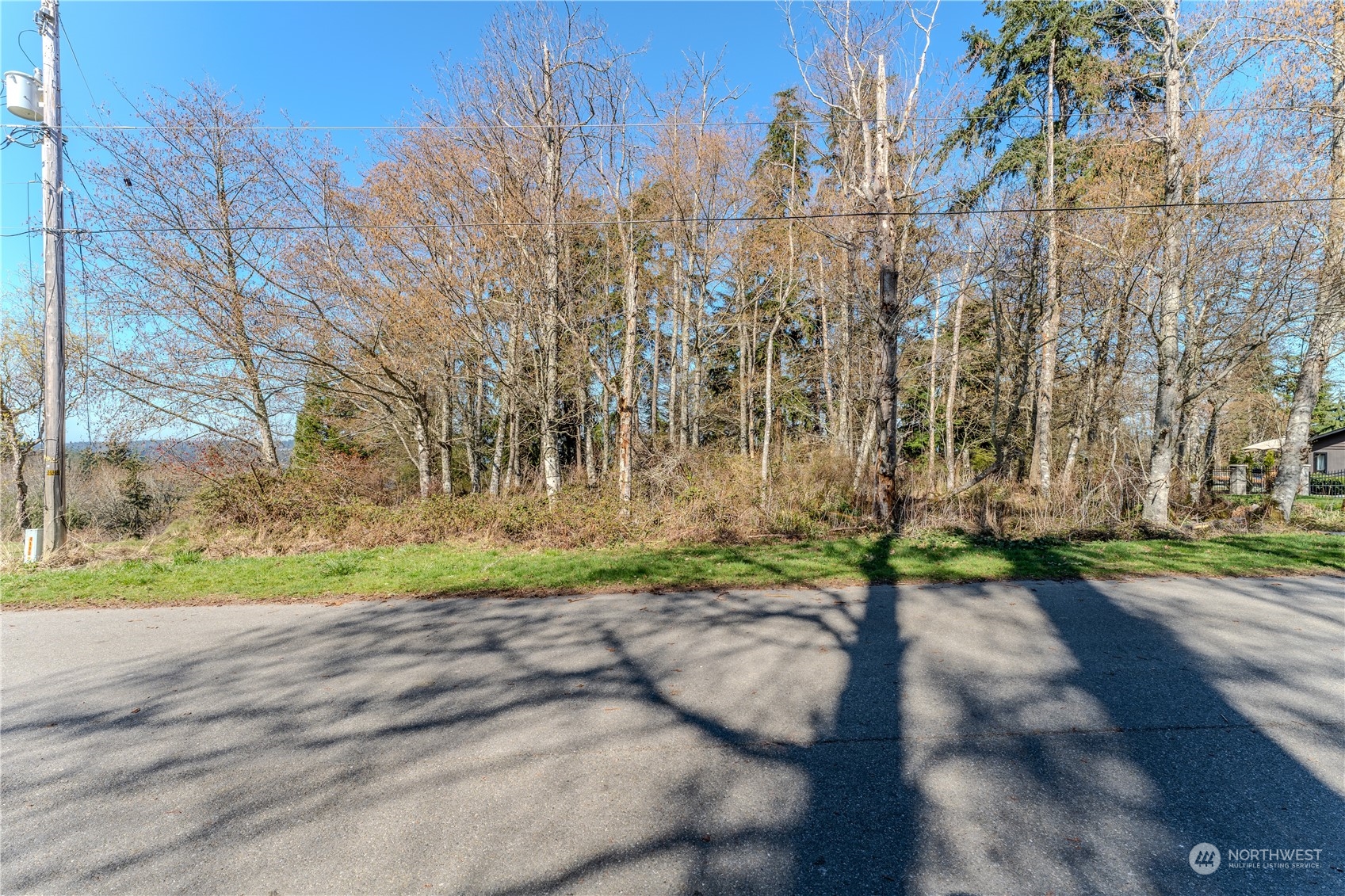 0 Greenoch Loop Oak Harbor, WA 98277 - Photo 20 of 34 a view of a street with a building in the background