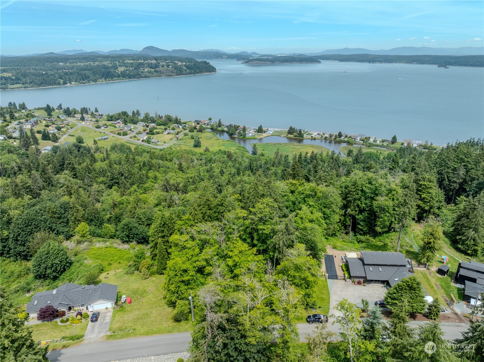 0 Greenoch Loop Oak Harbor, WA 98277 - Photo 4 of 34 an aerial view of a houses with a yard and lake view