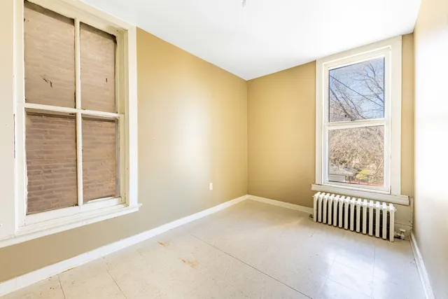 a kitchen with stainless steel appliances a stove and a microwave
