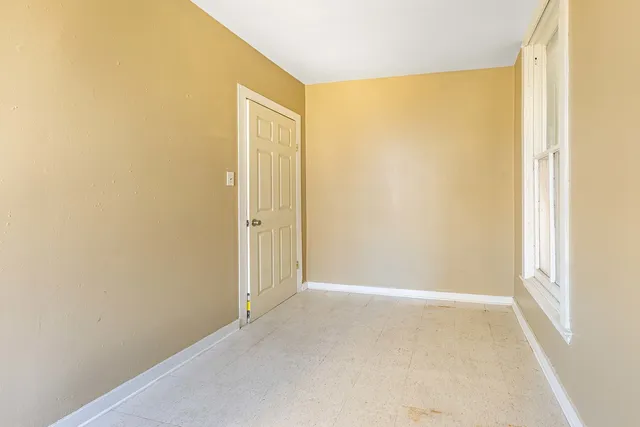 a view of a bathroom with tub and window