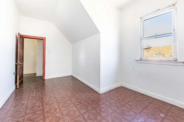 a view of a room that has a window in it