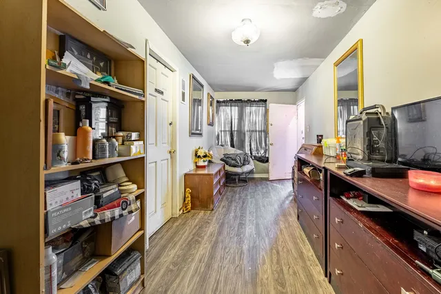 a very nice looking room with wooden floor and furniture