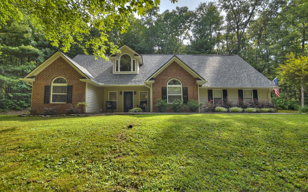 8122 Boardtown Road Ellijay, GA 30540 - Photo 1 of 1 a front of a house with a garden