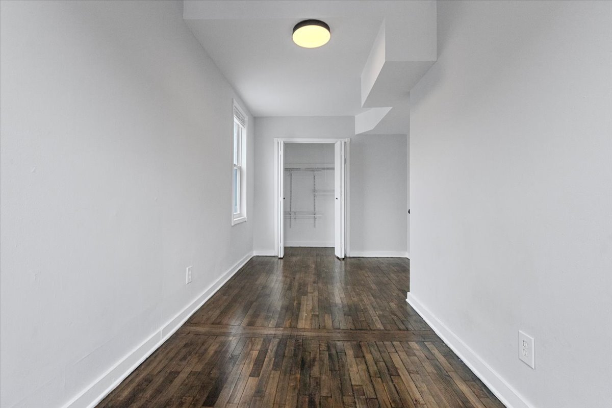 1849 West Augusta Boulevard, Unit 3 Chicago, IL 60622 - Photo 9 of 11 a view of a room with wooden floor and has more windows