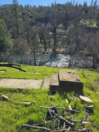 a view of a swimming pool with a yard