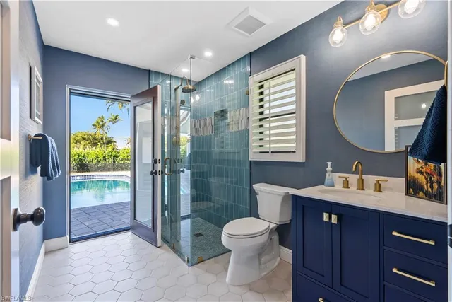 a spacious bathroom with a sink a toilet and shower