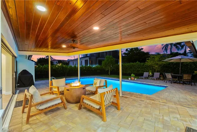 a view of swimming pool with a patio