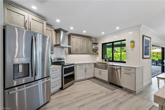 a kitchen with a refrigerator sink and microwave