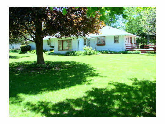 6911 Halley Road Rockford, IL 61101 - Photo 4 of 11 a front view of a house with a yard