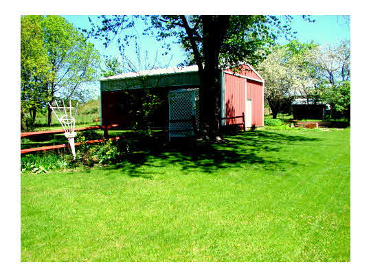 6911 Halley Road Rockford, IL 61101 - Photo 5 of 11 a front view of a house with garden