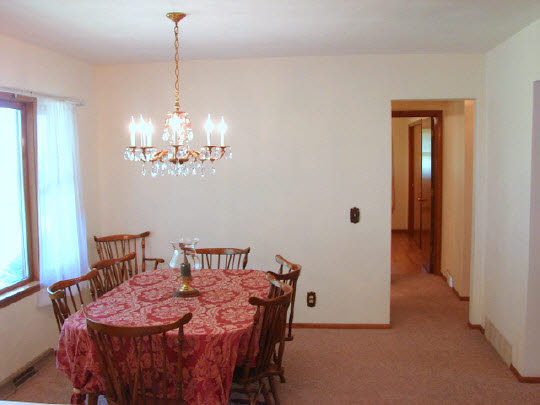 6911 Halley Road Rockford, IL 61101 - Photo 8 of 11 a view of a dining room with furniture and chandelier