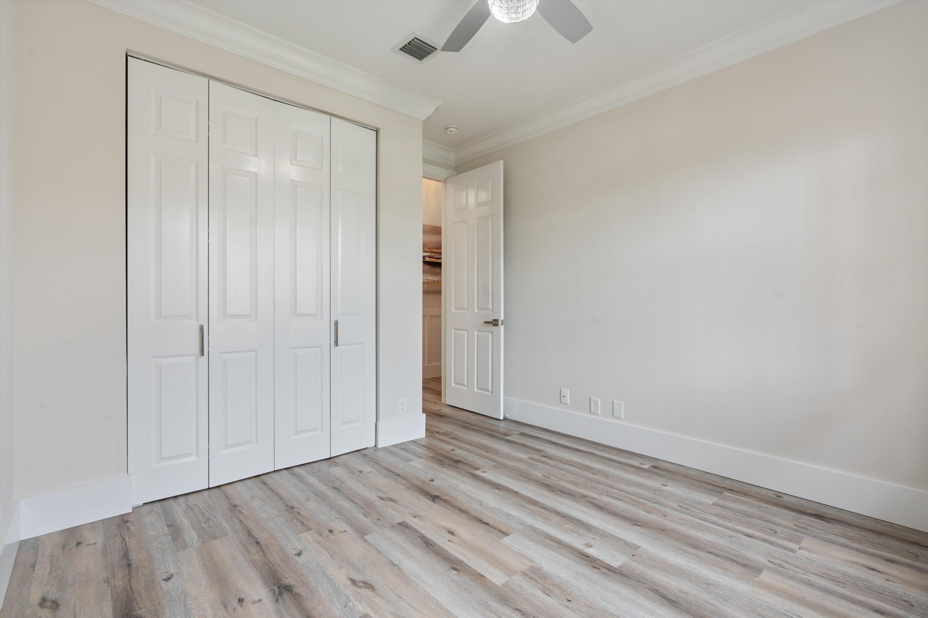 6661 Garde Road Boynton Beach, FL 33472 - Photo 22 of 48 wooden floor in an empty room