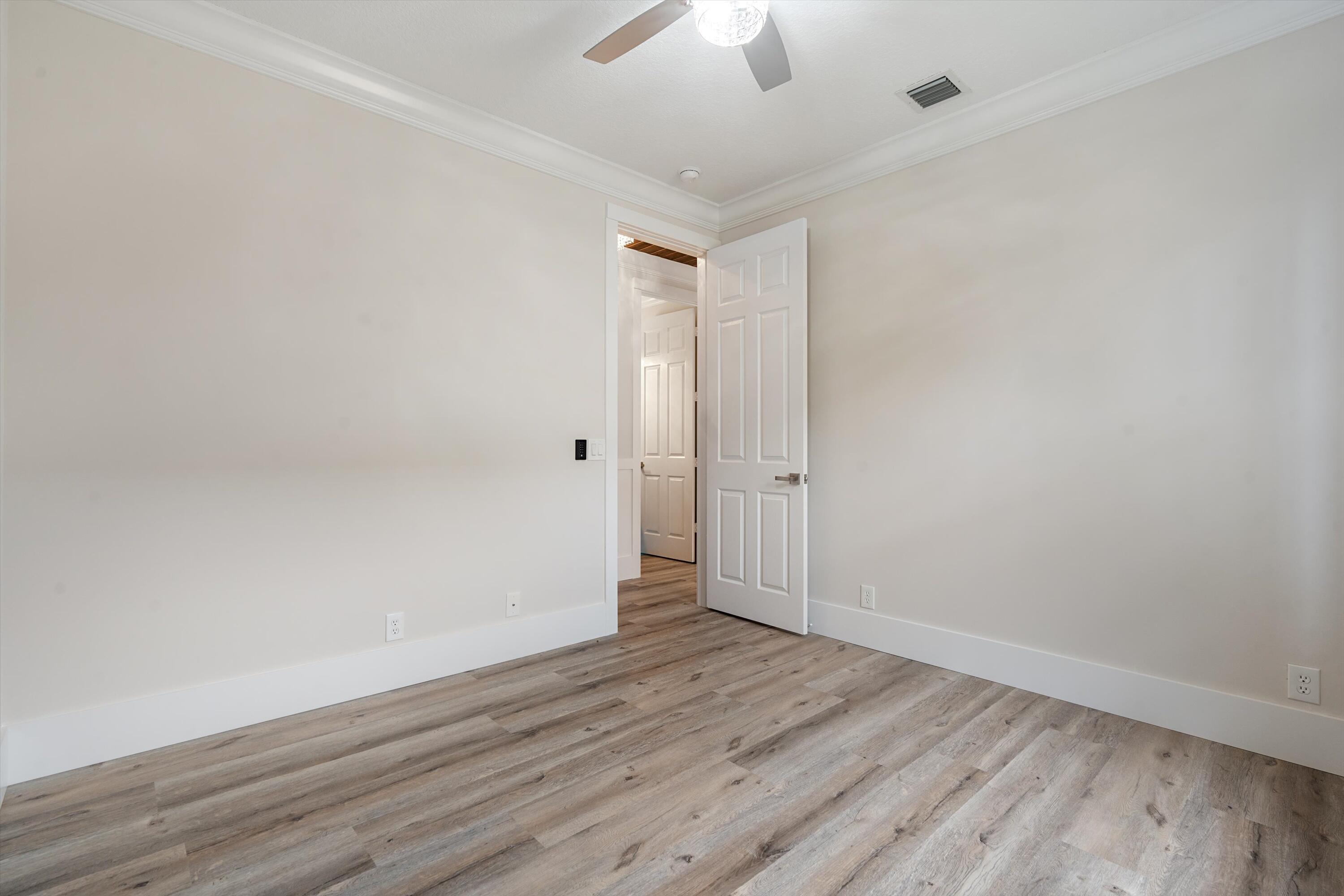 6661 Garde Road Boynton Beach, FL 33472 - Photo 25 of 48 wooden floor in an empty room