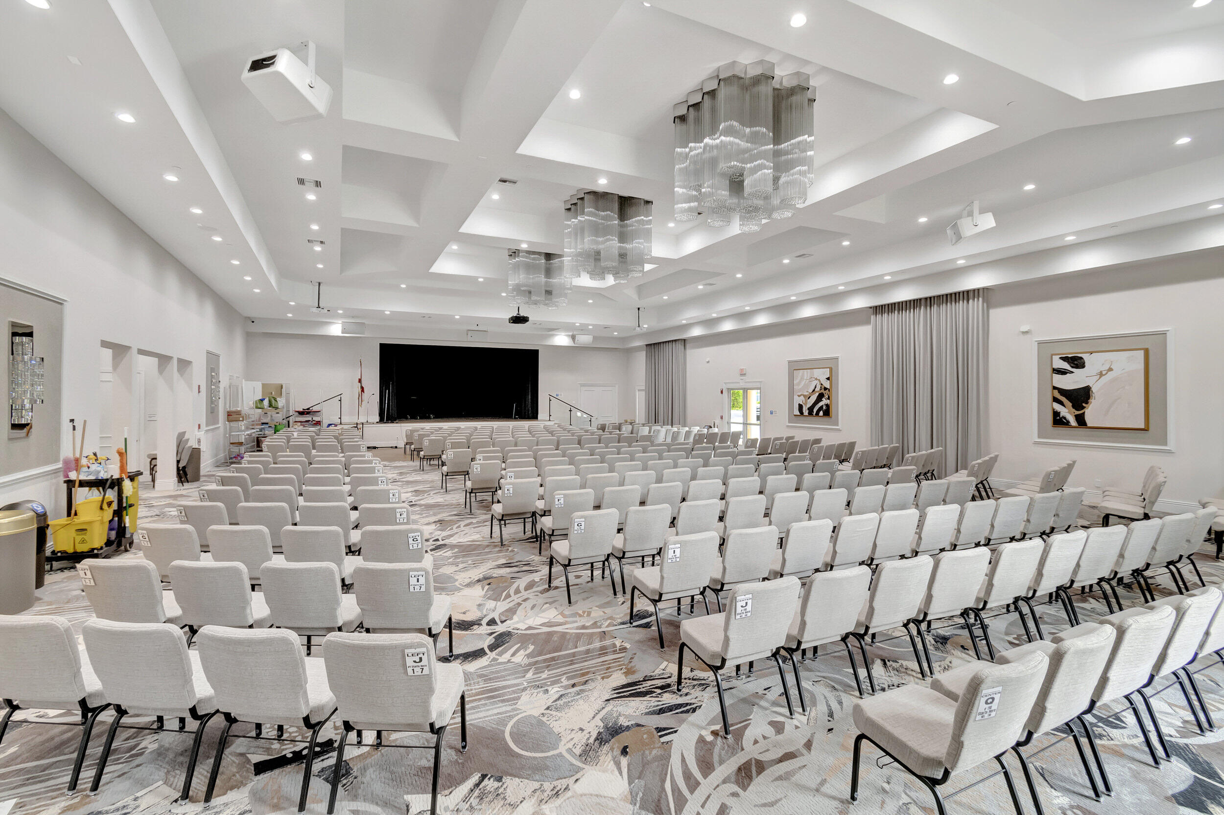 6661 Garde Road Boynton Beach, FL 33472 - Photo 39 of 48 a large room with lots of chairs and mirrors