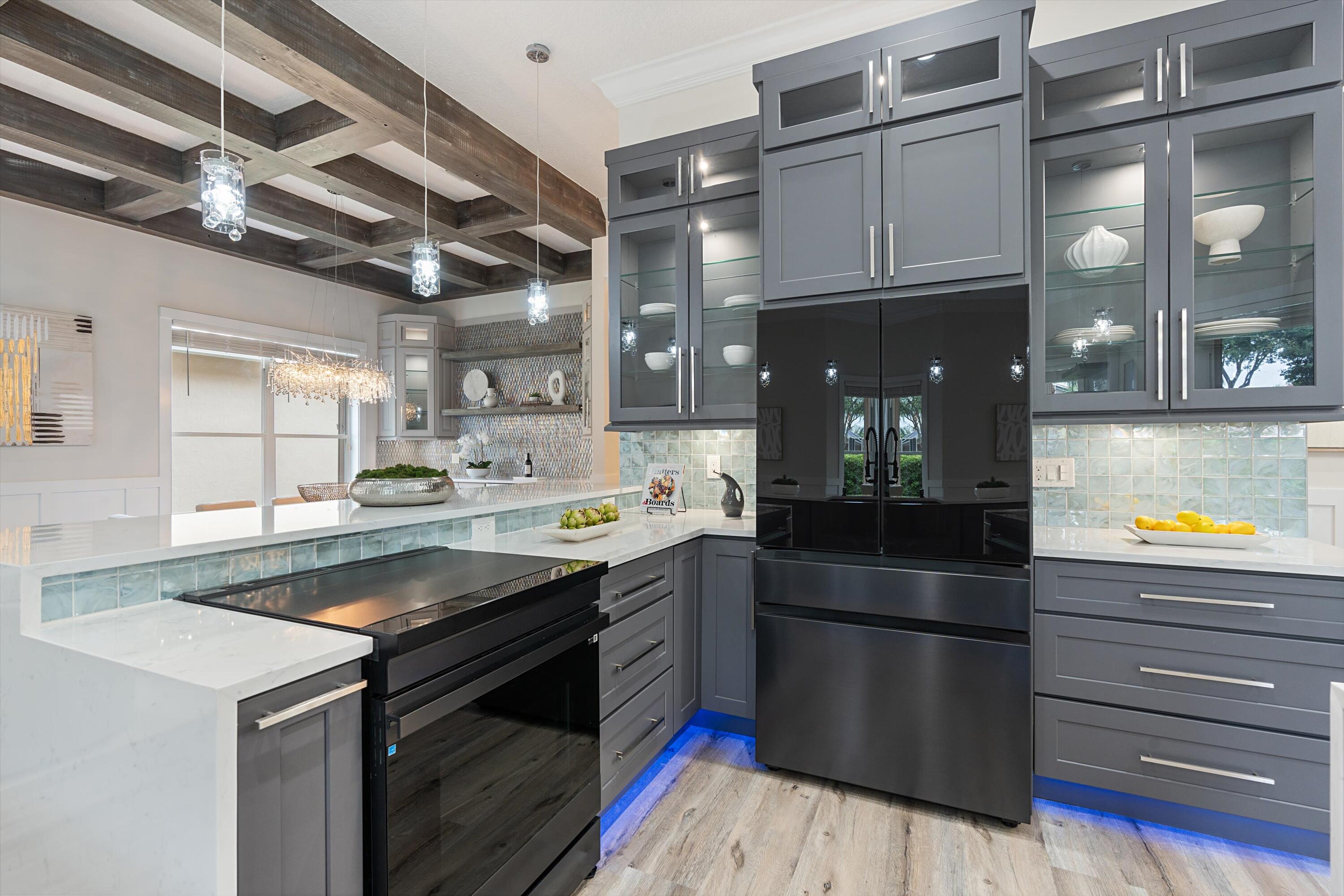 6661 Garde Road Boynton Beach, FL 33472 - Photo 9 of 48 a kitchen with a sink appliances and cabinets