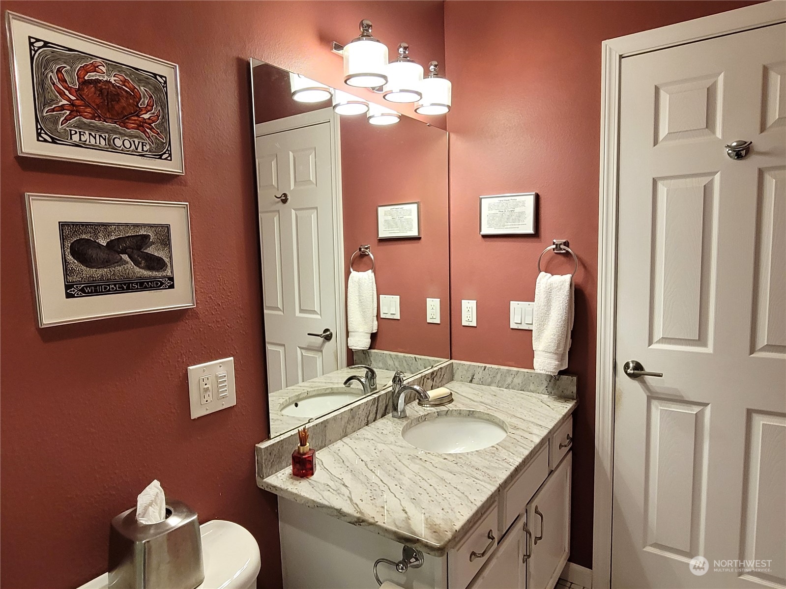 590 East Bush Point Road Freeland, WA 98249 - Photo 13 of 25 a bathroom with a sink vanity granite and a mirror