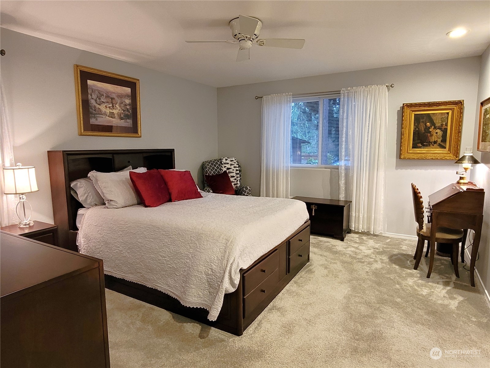 590 East Bush Point Road Freeland, WA 98249 - Photo 15 of 25 a spacious bedroom with a bed and a table in it