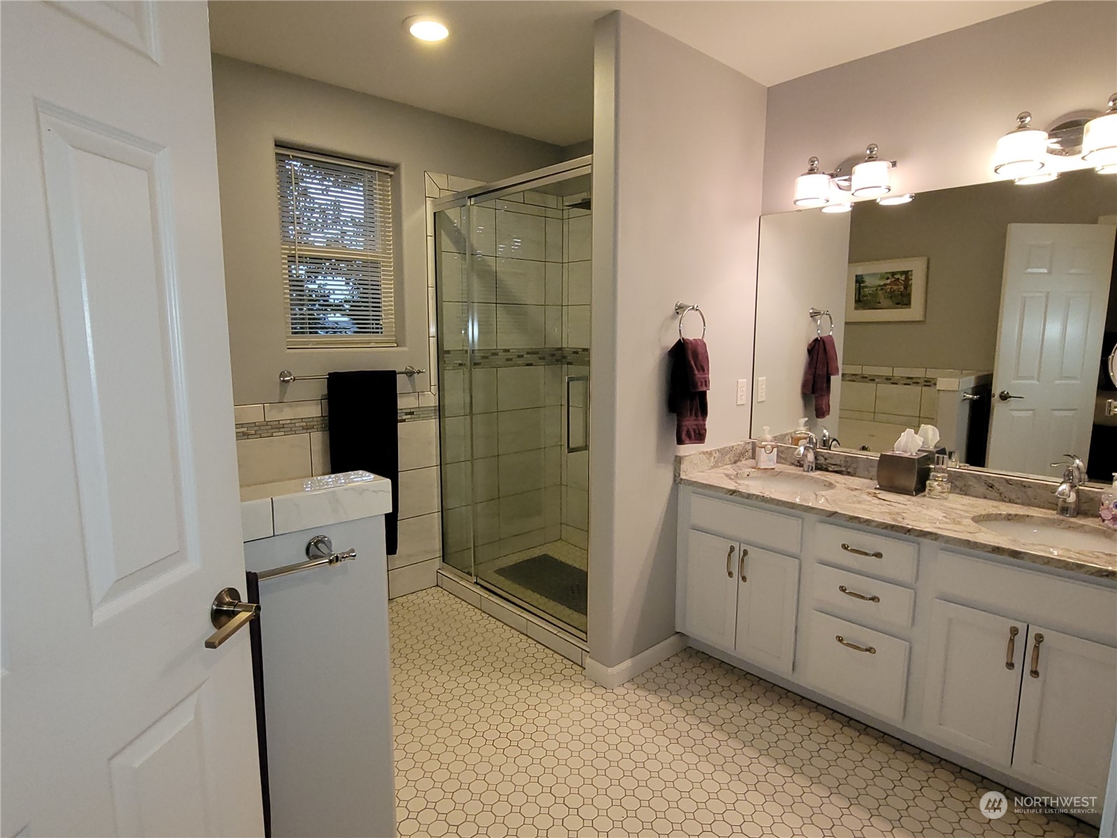 590 East Bush Point Road Freeland, WA 98249 - Photo 16 of 25 a bathroom with a double vanity sink toilet and shower