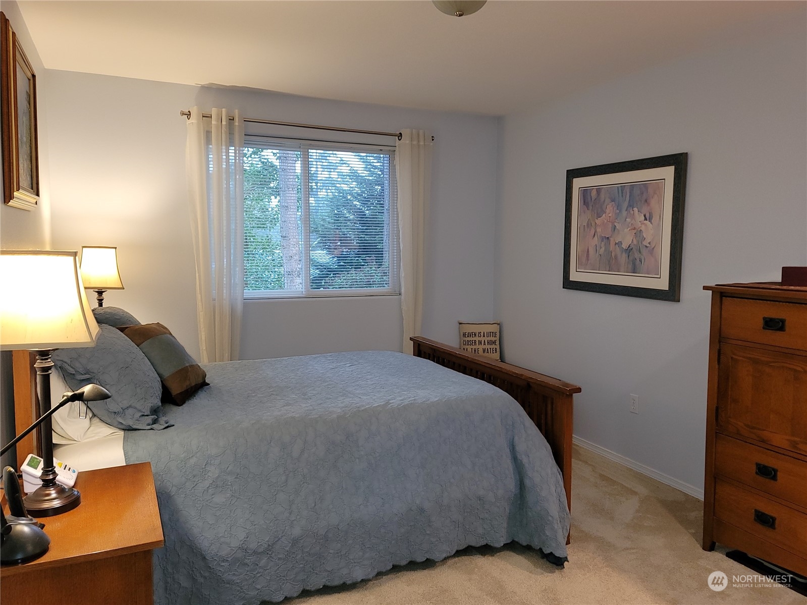 590 East Bush Point Road Freeland, WA 98249 - Photo 17 of 25 a bed room with a bed and a window