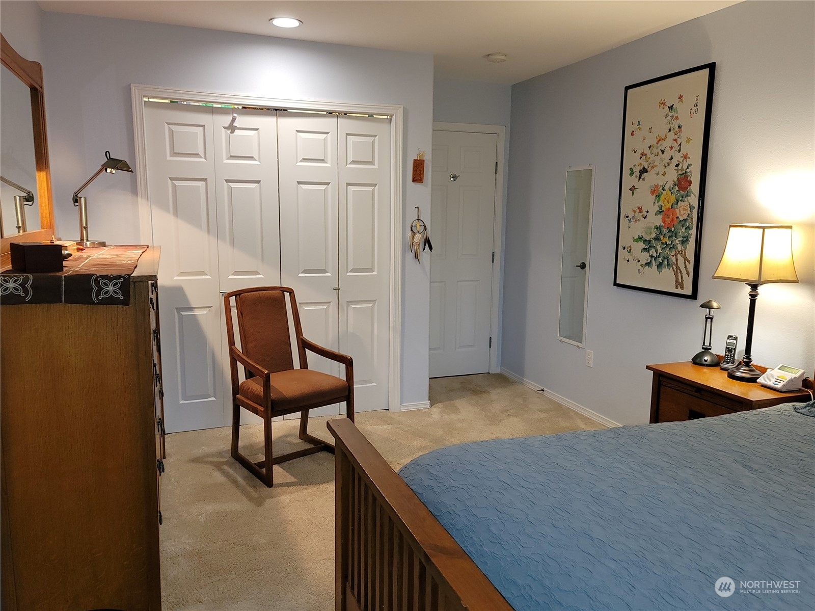 590 East Bush Point Road Freeland, WA 98249 - Photo 18 of 25 a bedroom with a bed and furniture