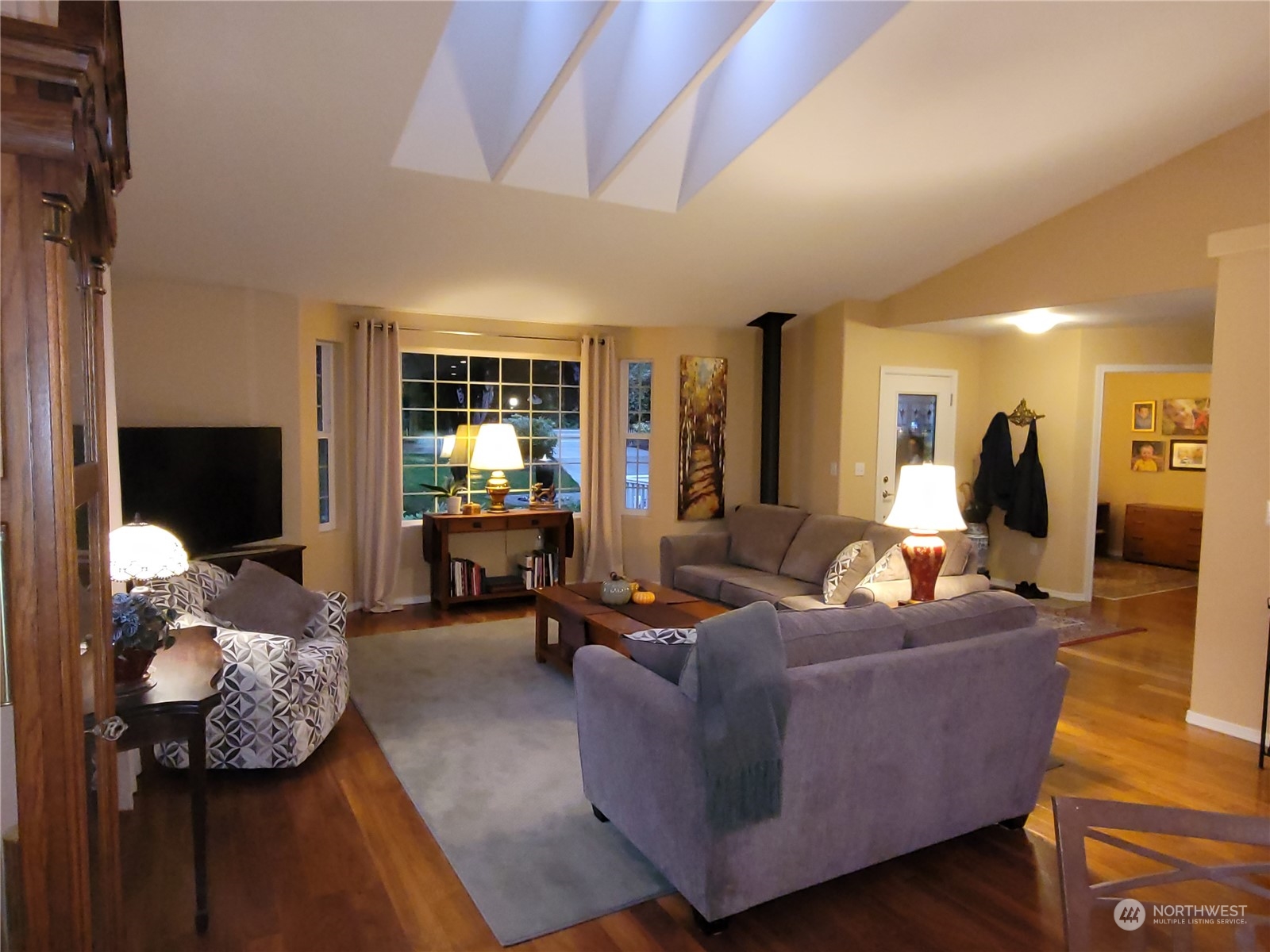 590 East Bush Point Road Freeland, WA 98249 - Photo 5 of 25 a living room with furniture and a flat screen tv