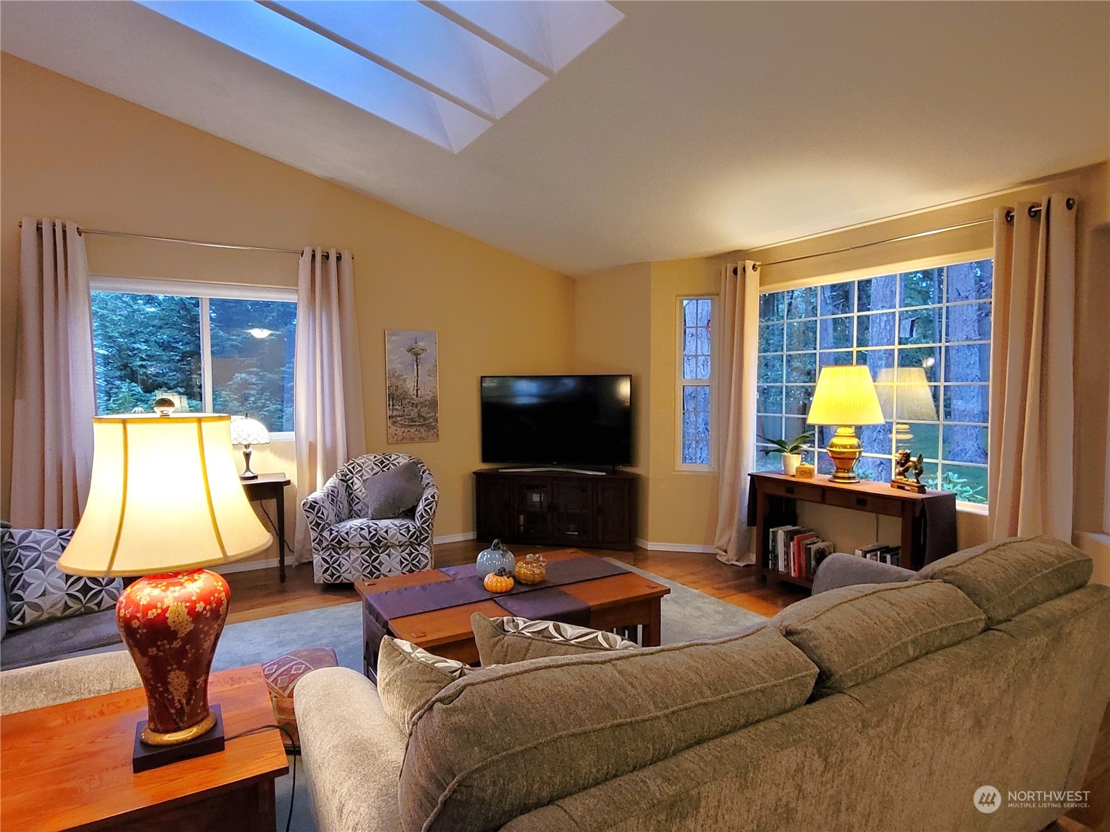 590 East Bush Point Road Freeland, WA 98249 - Photo 6 of 25 a living room with furniture and a flat screen tv