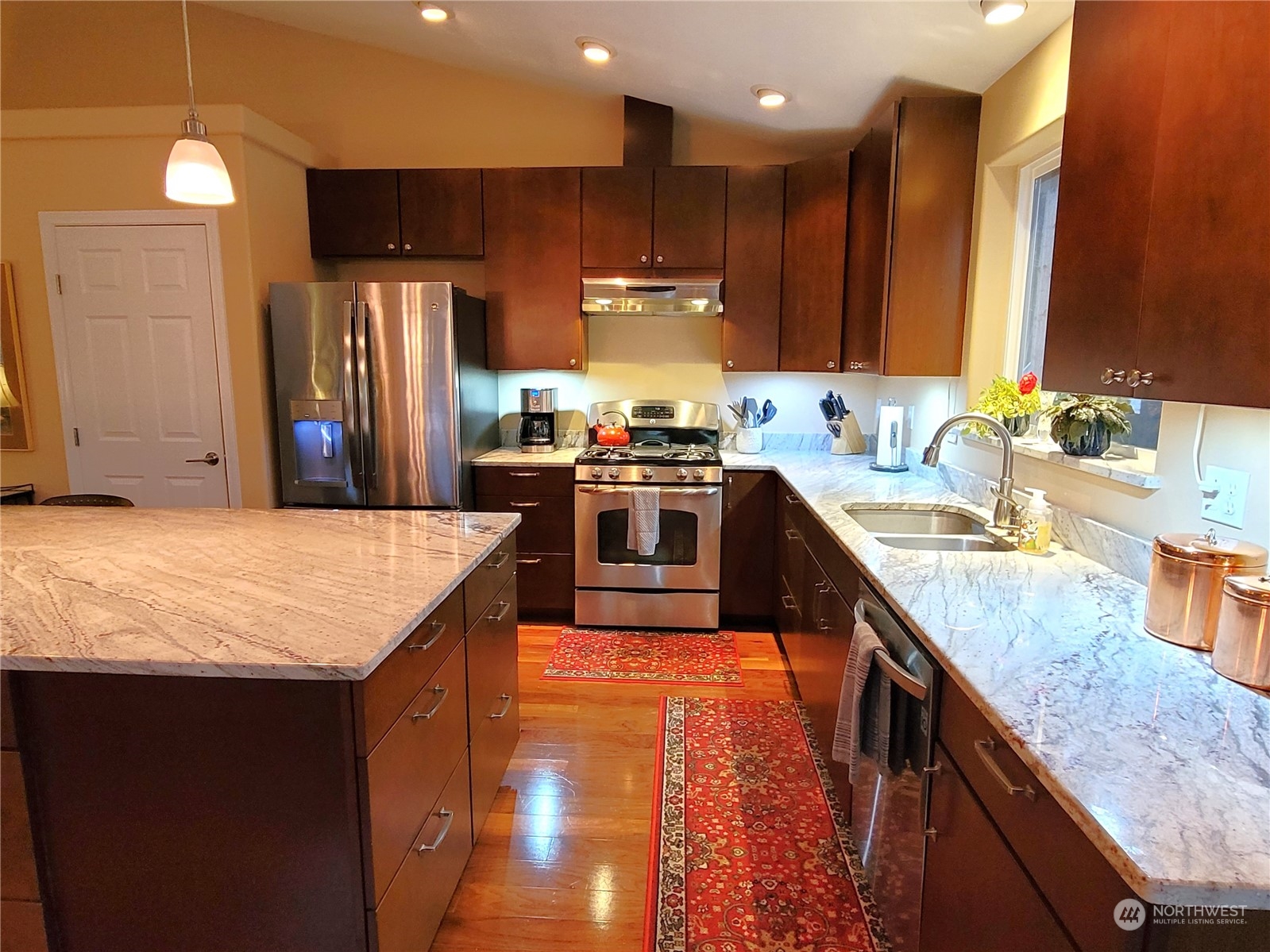 590 East Bush Point Road Freeland, WA 98249 - Photo 8 of 25 a kitchen with stainless steel appliances granite countertop sink stove top oven and refrigerator