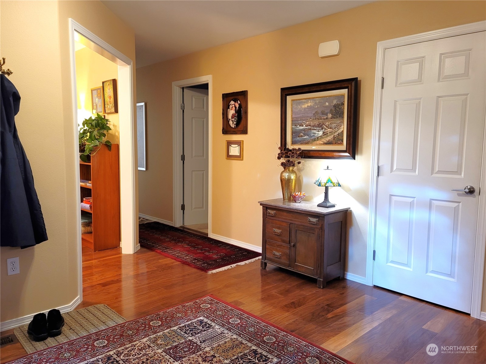 590 East Bush Point Road Freeland, WA 98249 - Photo 10 of 25 a living room with furniture and a wooden floor