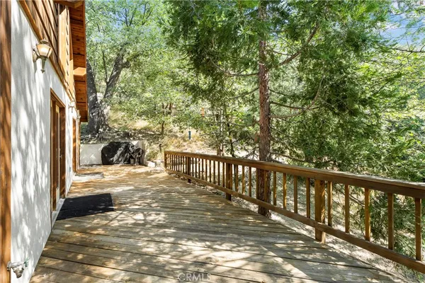 a view of a balcony with wooden floor