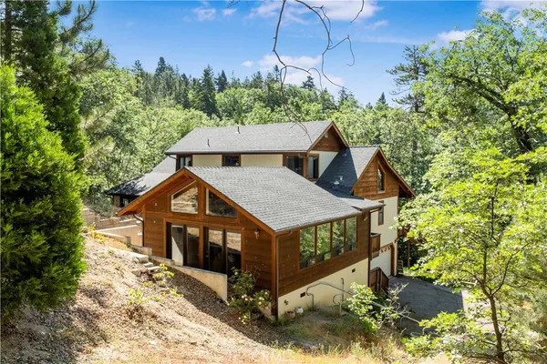 a aerial view of a house with a yard