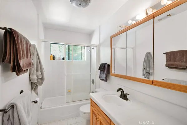 a bathroom with a tub and a sink