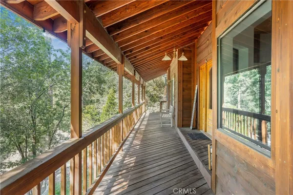 a view of balcony with wooden floor