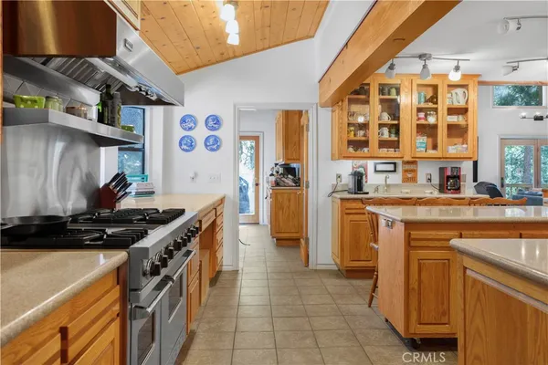 a kitchen with stainless steel appliances granite countertop a stove and a sink