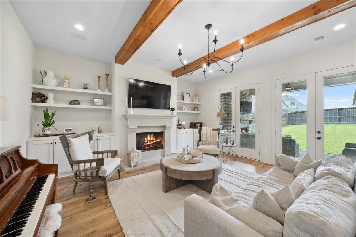 220 Mary Taylor Way Piperton, TN 38017 - Photo 18 of 40 a living room with furniture a fireplace and a flat screen tv