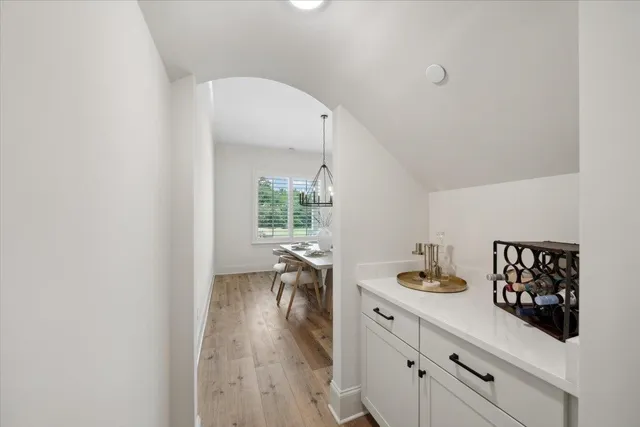 a kitchen with a white cabinets and stove