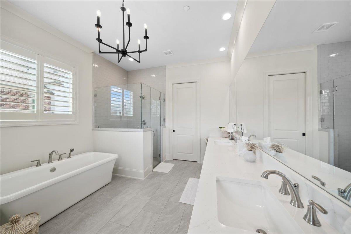 220 Mary Taylor Way Piperton, TN 38017 - Photo 24 of 40 a spacious bathroom with a tub sink and mirror