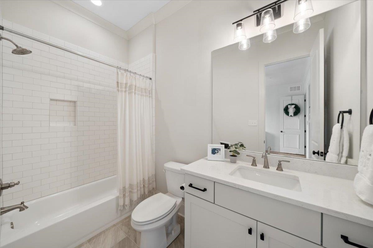 220 Mary Taylor Way Piperton, TN 38017 - Photo 30 of 40 a bathroom with a sink a toilet and shower