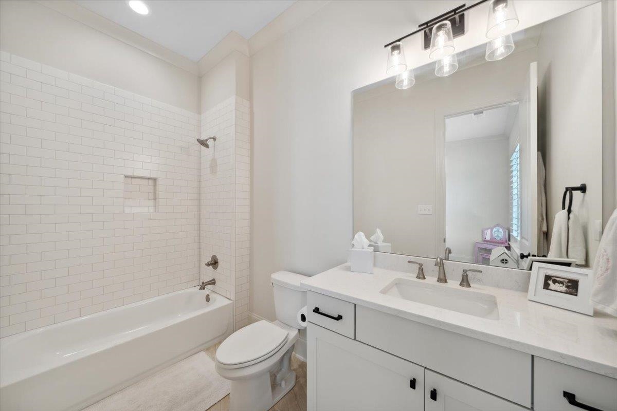 220 Mary Taylor Way Piperton, TN 38017 - Photo 32 of 40 a bathroom with a sink a toilet a tub and shower